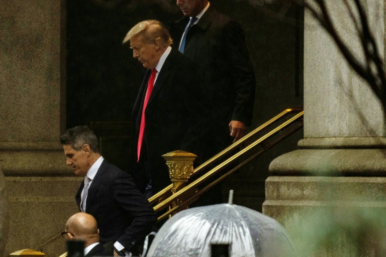 Former US president Donald Trump leaves a Washington hotel after attending an appeals court hearing on his claim that he is immune from prosecution