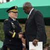 US Defense Secretary Lloyd Austin greets retiring Chairman of the Joint Chiefs of Staff, General Mark Milley