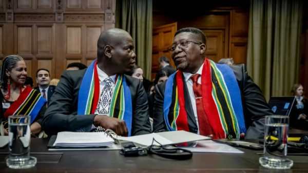 No armed attack, no matter how serious, could justify Israel's response, Justice Minister Ronald Lamola (left) told the court