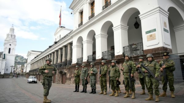 Soldiers stand guard outside the presidential palace in downtown Quito on January 10, 2024