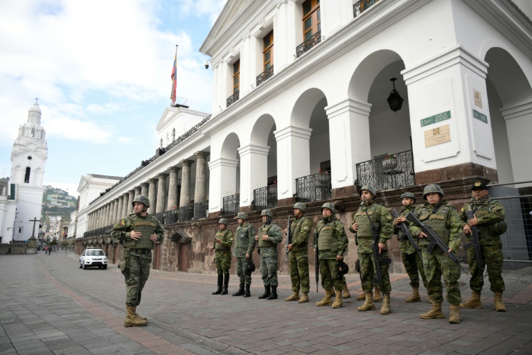 Soldiers stand guard outside the presidential palace in downtown Quito on January 10, 2024