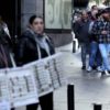 Spanish citizens and tourists spend hours in a queue to buy a ticket in Spain's popular Christmas lottery "El Gordo" (the Fat One)