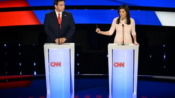 Ron DeSantis (L) and Nikki Haley speak during the fifth Republican presidential primary debate at Drake University in Des Moines, Iowa, on January 10, 2024