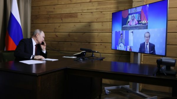 Bangladesh's Prime Minister Sheikh Hasina thanked Russian President Vladimir Putin (L) for "his guidance and assistance in implementing this project" during a videoconference