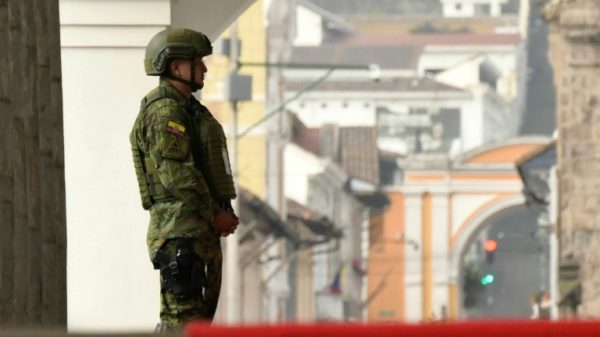 A soldier stands guard outside Carondelet Presidential Palace in Quito on January 9, 2024, a day after Ecuadoran President Daniel Noboa declared a state of emergency following the escape from prison of a dangerous narco boss