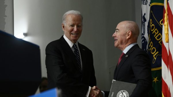 US President Joe Biden (left) and Homeland Security Secretary Alejandro Mayorkas are both facing Republican-led impeachment hearings
