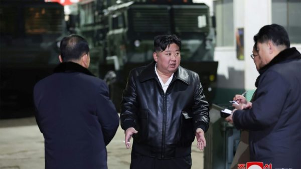 North Korean leader Kim Jong Un (C) labeled South Korea his country's 'principal enemy' while on a tour of a major munitions factory
